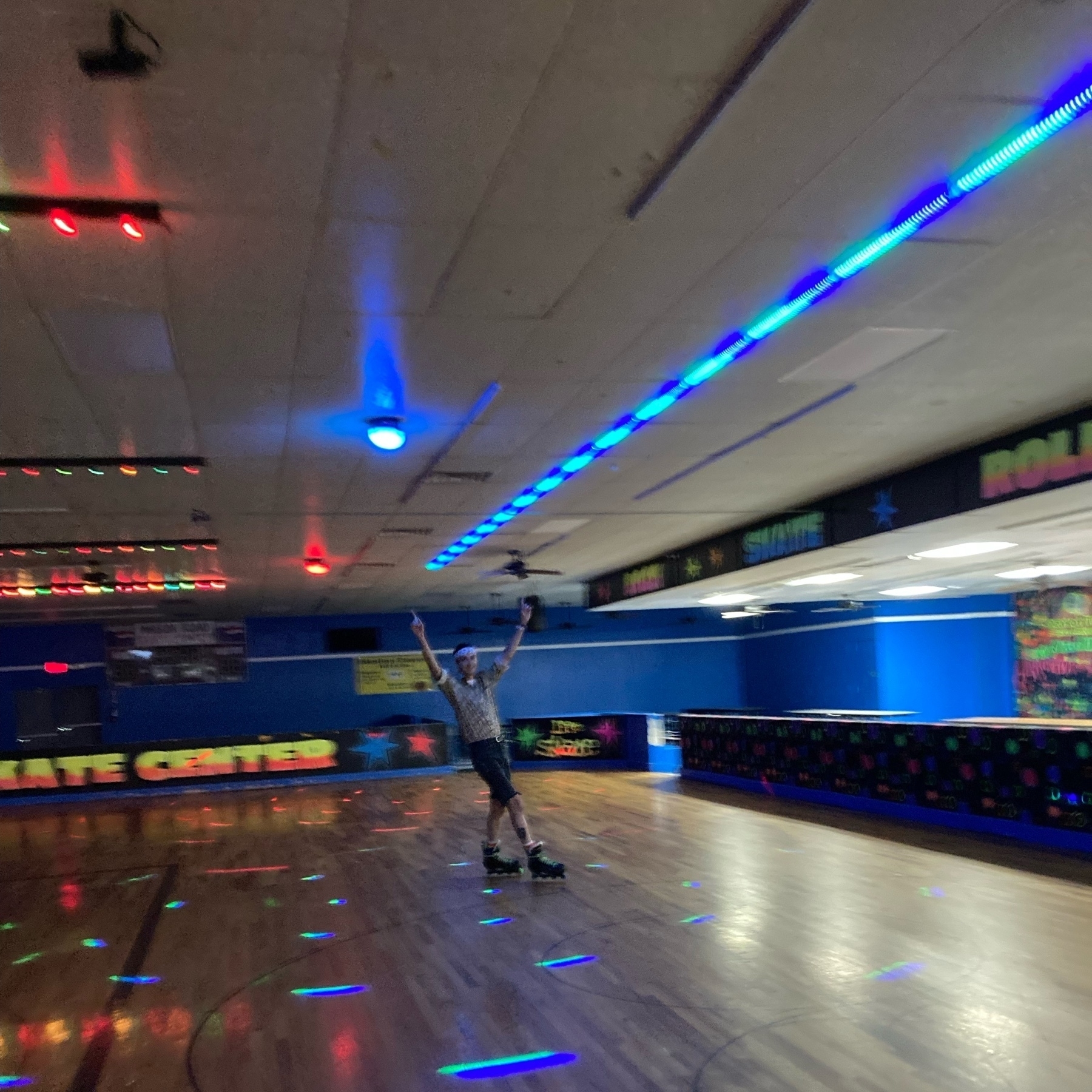 A blurry image of a man roller skating